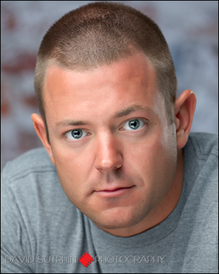 A different kind of headshot of Chuck photographed in the studio with studio lighting.