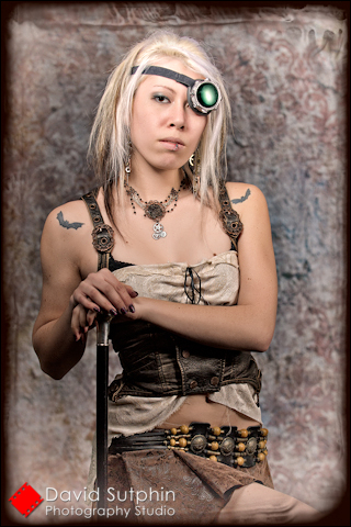 Portrait of Krystalle in Steampunk costume with cane.